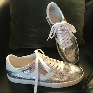 Stuart Weizmann silver tennis shoes. Luxury brand footwear.